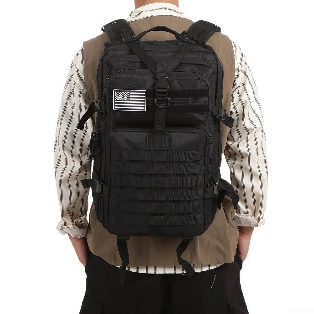 Black tactical backpack with MOLLE webbing front panel and adjustable shoulder straps