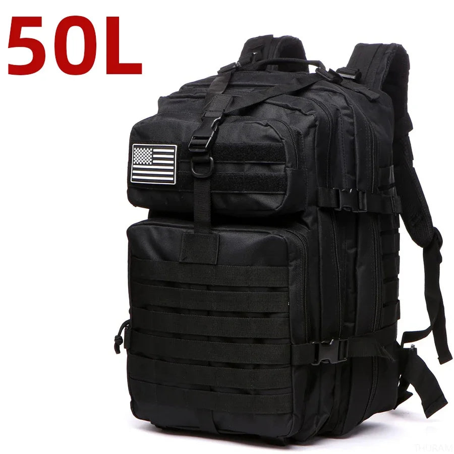 Black tactical backpack with MOLLE webbing, front zip pocket, padded shoulder straps