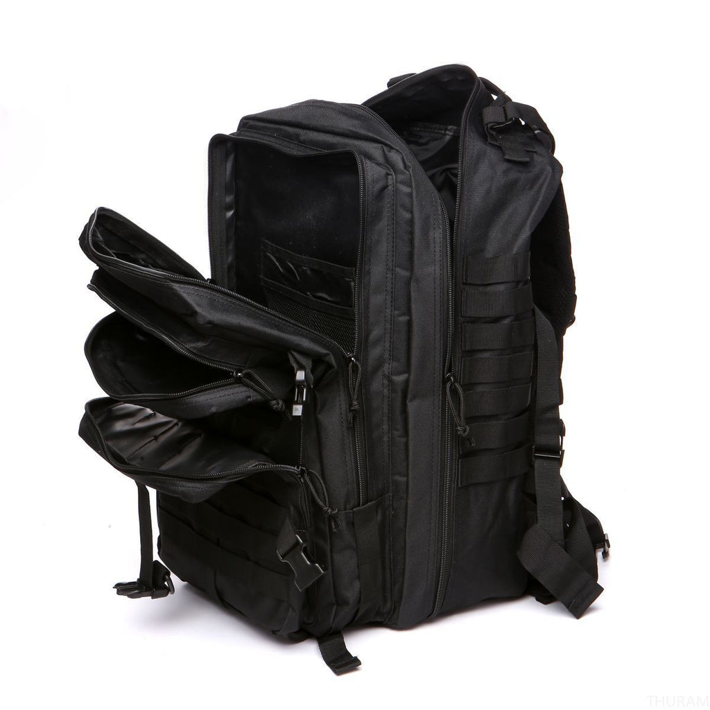 Black tactical backpack with MOLLE webbing, side pocket, and dual zip compartments