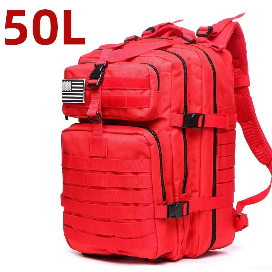Red tactical backpack with front zip pockets and MOLLE webbing, padded shoulder strap
