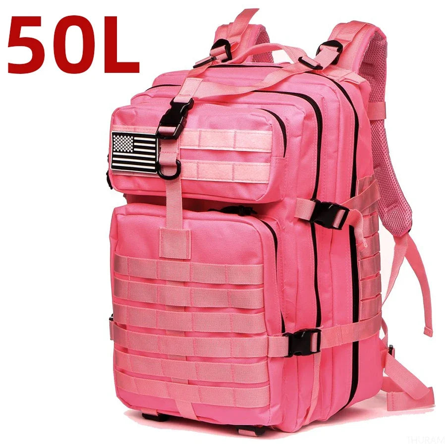 Pink tactical backpack with front zip compartments and MOLLE webbing, padded shoulder strap