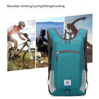 Teal backpack with images of people engaging in outdoor activities on a white background