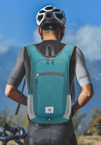 Person wearing a teal backpack with a blue sky background