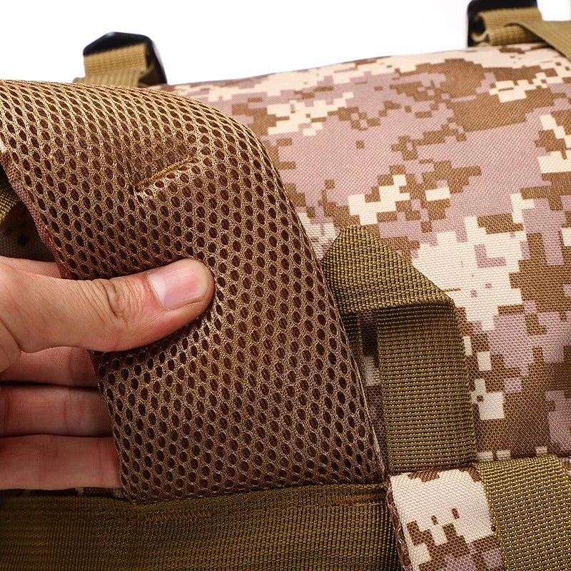 Tactical backpack shoulder strap with mesh padding and desert camo fabric.