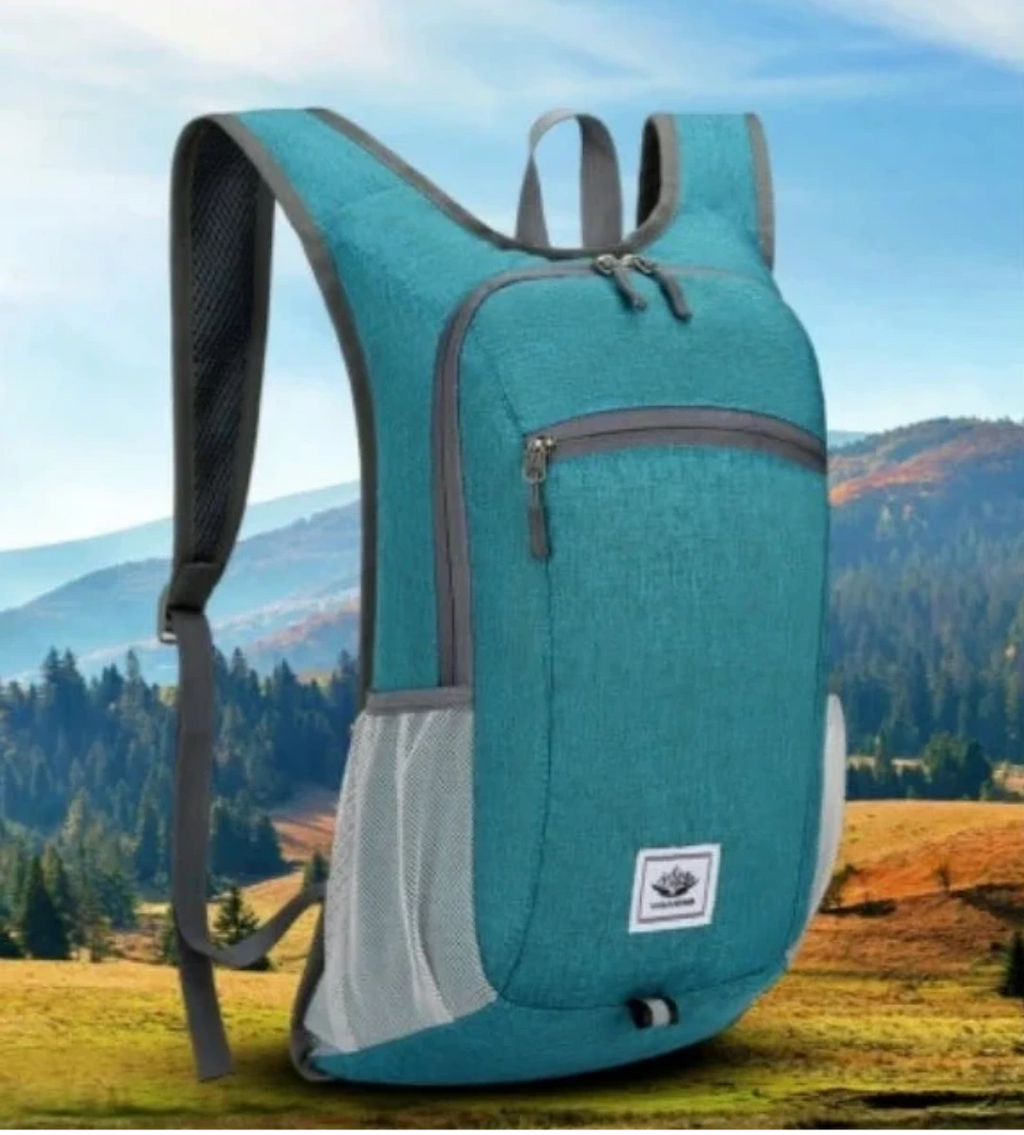 Teal cycling backpack with mountain landscape in the background