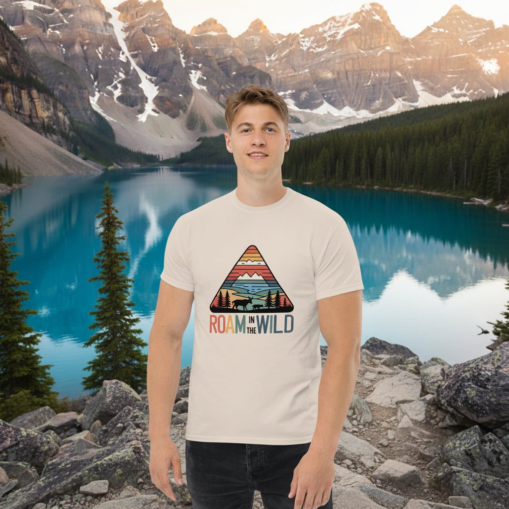 White adventure T-shirt with triangle “Roam the Wild” landscape graphic