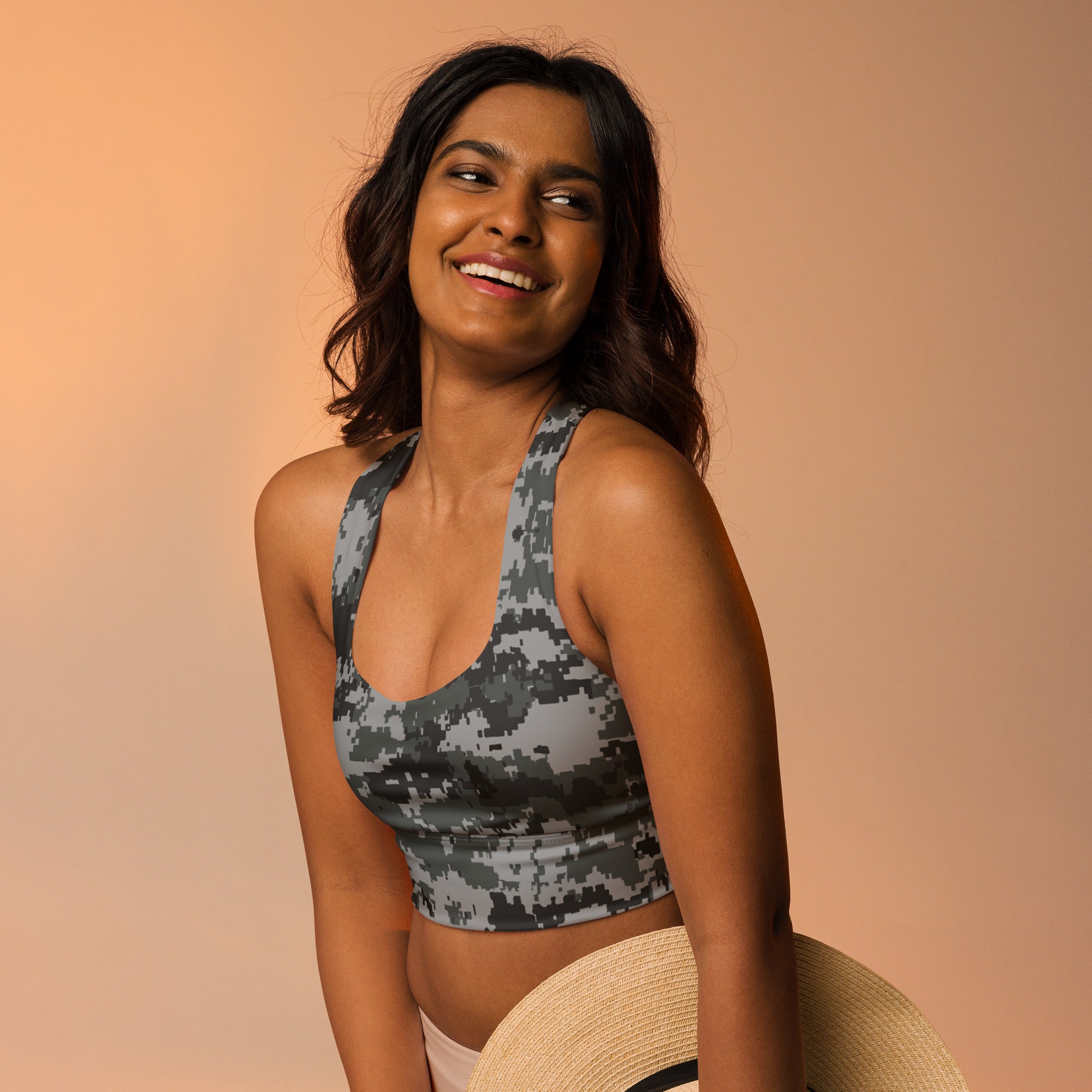 Longline sports bra with dark digital camo print and racerback straps