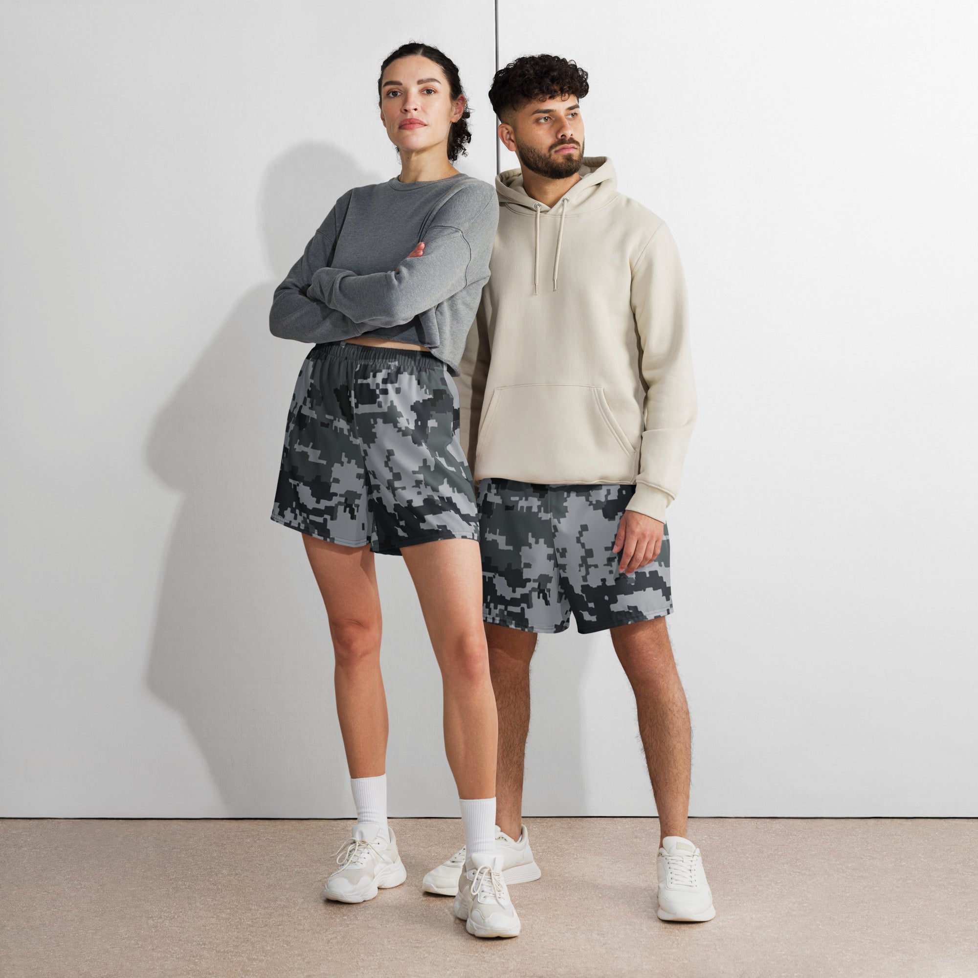 Digital camo athletic long shorts paired with hoodie, elastic waistband, dark gray and black