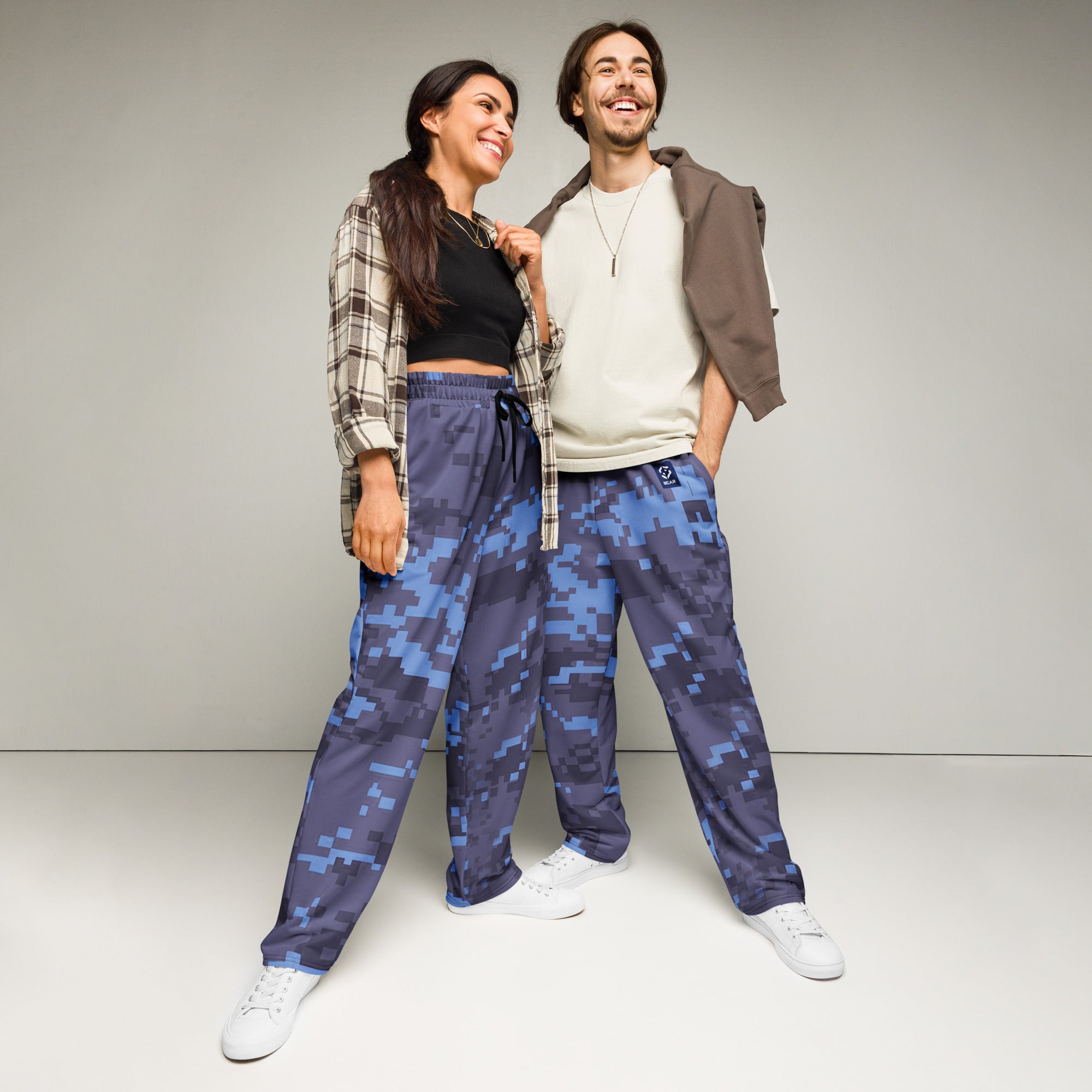 Wide-leg joggers in digital camouflage print with elastic waistband and drawstring, full body view