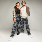 Wide-leg digital camo joggers on models, showing relaxed fit and elastic waistband
