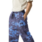 Wide-leg joggers showing elastic waistband, drawstring ties, and side pockets in camo print