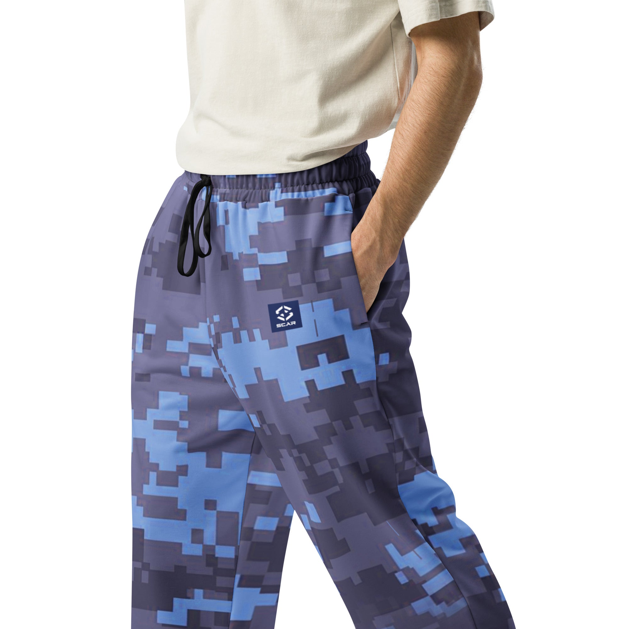 Wide-leg joggers showing elastic waistband, drawstring ties, and side pockets in camo print