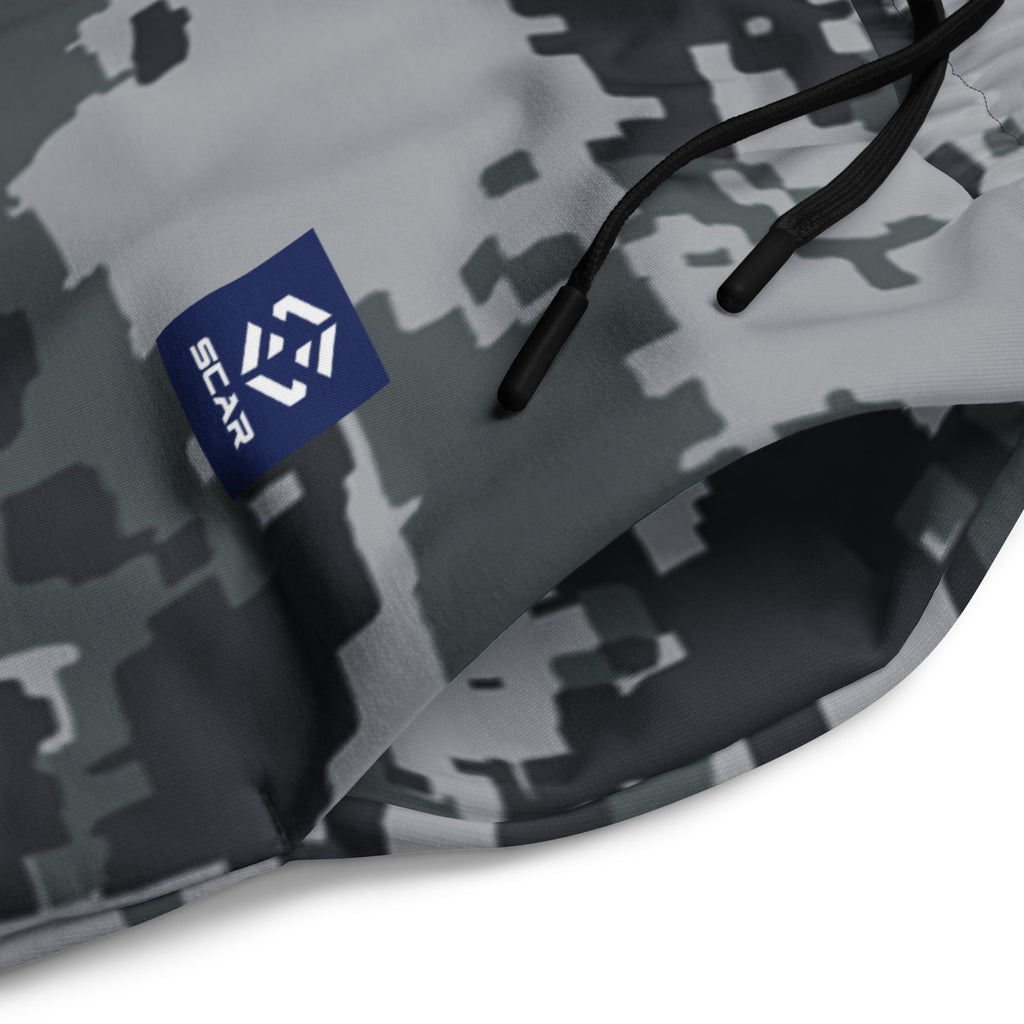 Close-up of dark digital camo joggers fabric with drawstring and seam details
