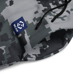 Close-up of dark digital camo joggers fabric with drawstring and seam details