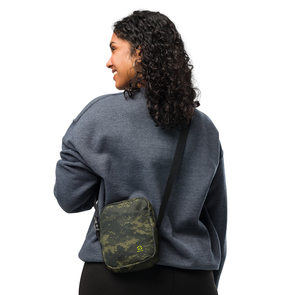 Digital camo crossbody bag worn on shoulder with black strap and front pocket