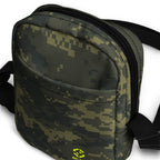 Digital camo crossbody bag close-up with curved front, dual zippers, and black trim.