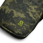 Close-up of digital camo crossbody bag corner with neon logo patch
