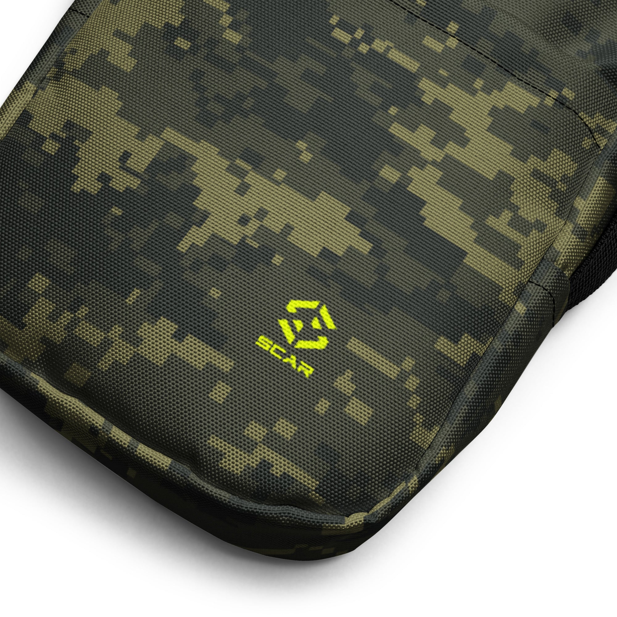 Close-up of digital camo crossbody bag corner with neon logo patch