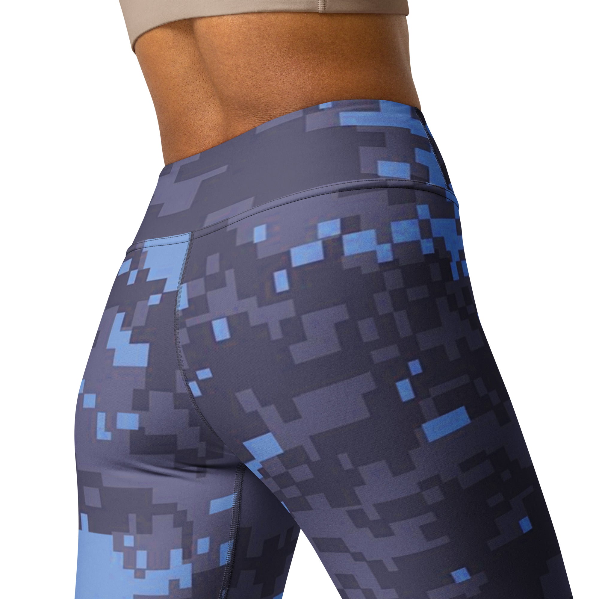 Close-up of navy digital camouflage yoga leggings fabric with smooth sculpted fit