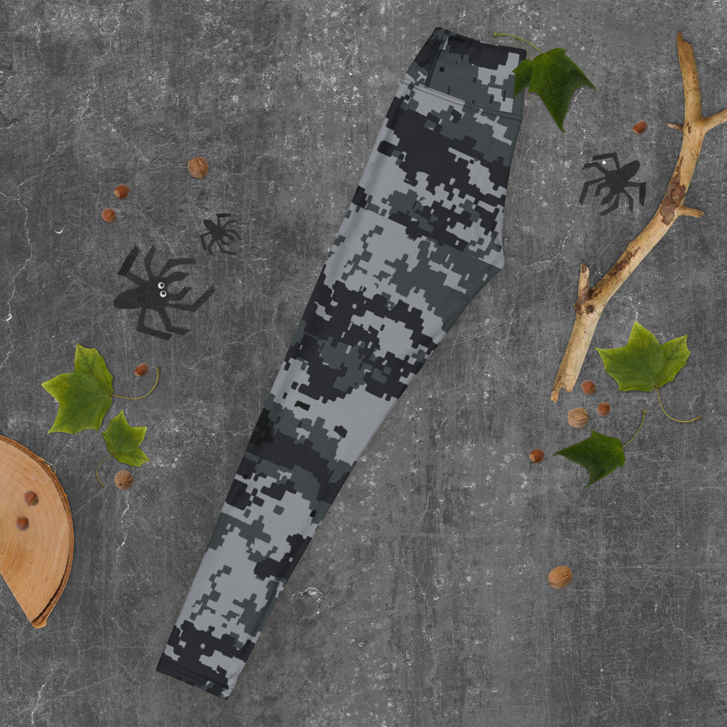 Digital camo yoga leggings laid flat, high-rise waistband, dark gray pattern