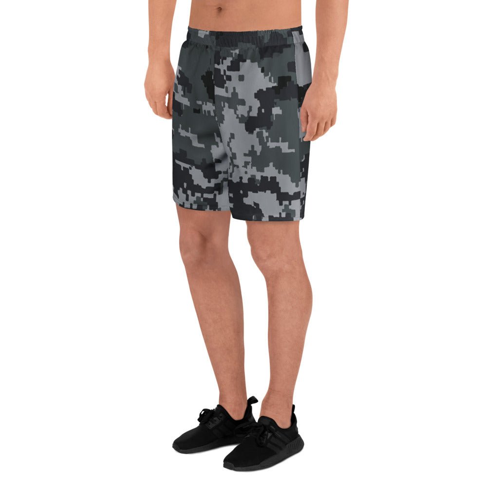 Digital camo athletic long shorts with elastic waistband, model standing