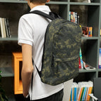 Camouflage backpack worn from the back with shoulder straps and front pocket.