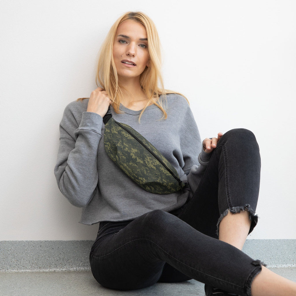 Camouflage fanny pack worn crossbody with black strap and zippered main pocket