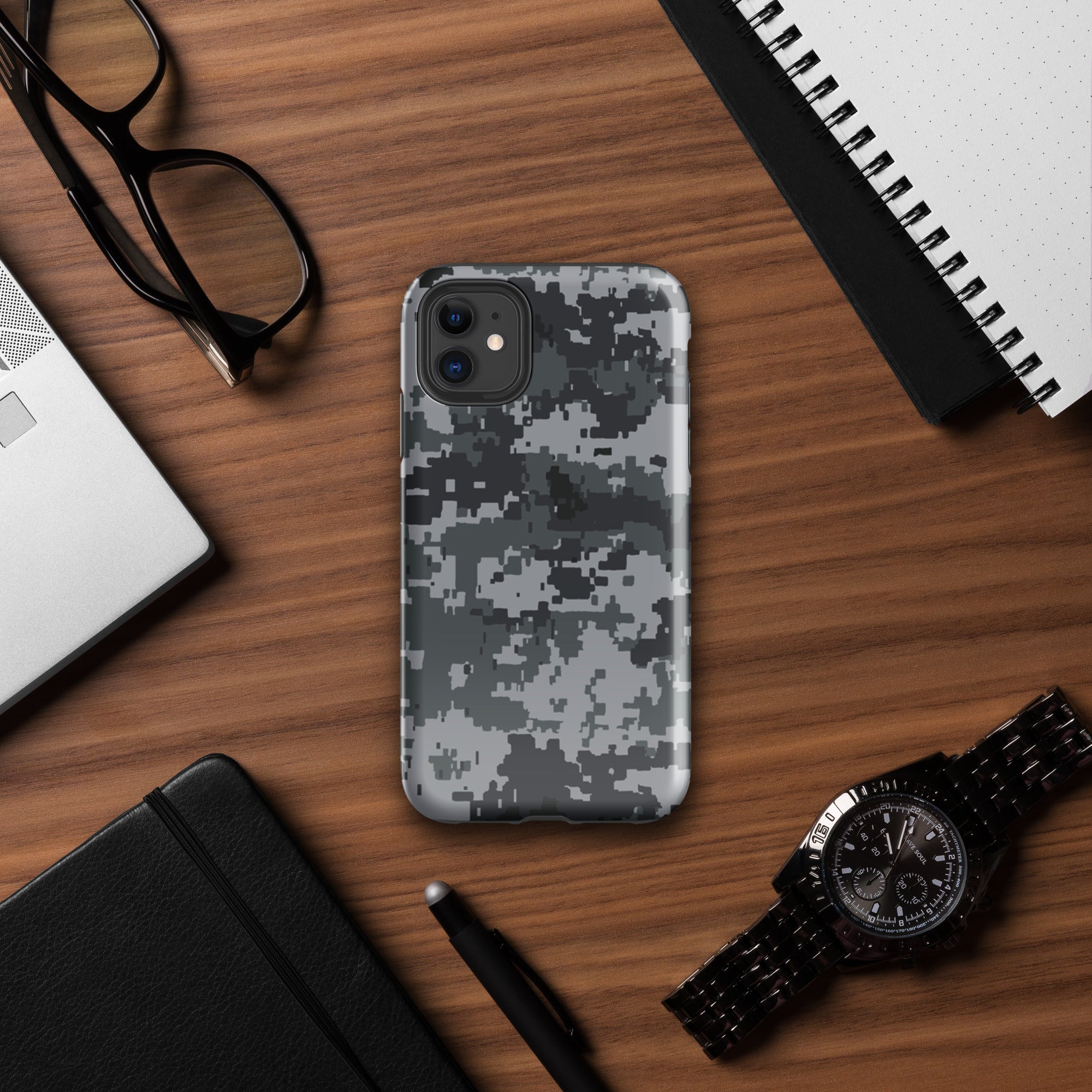 Gray digital camo iPhone case with raised camera bezel and cutouts