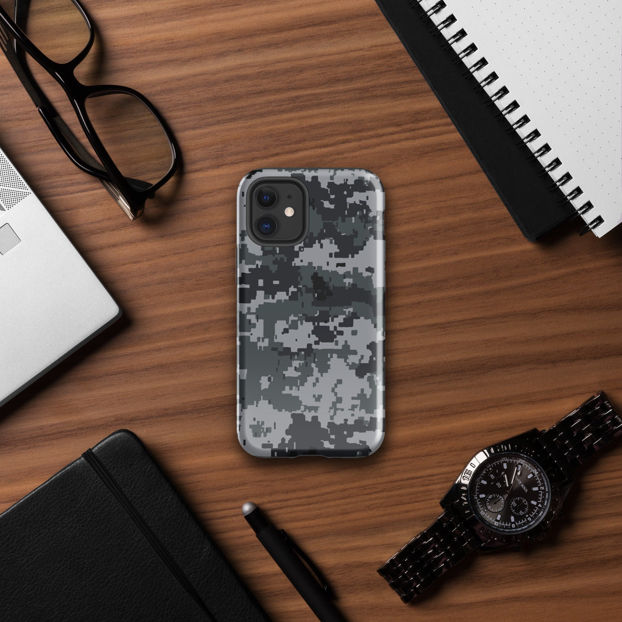 Gray digital camo iPhone case with raised camera cutouts, rugged hard cover