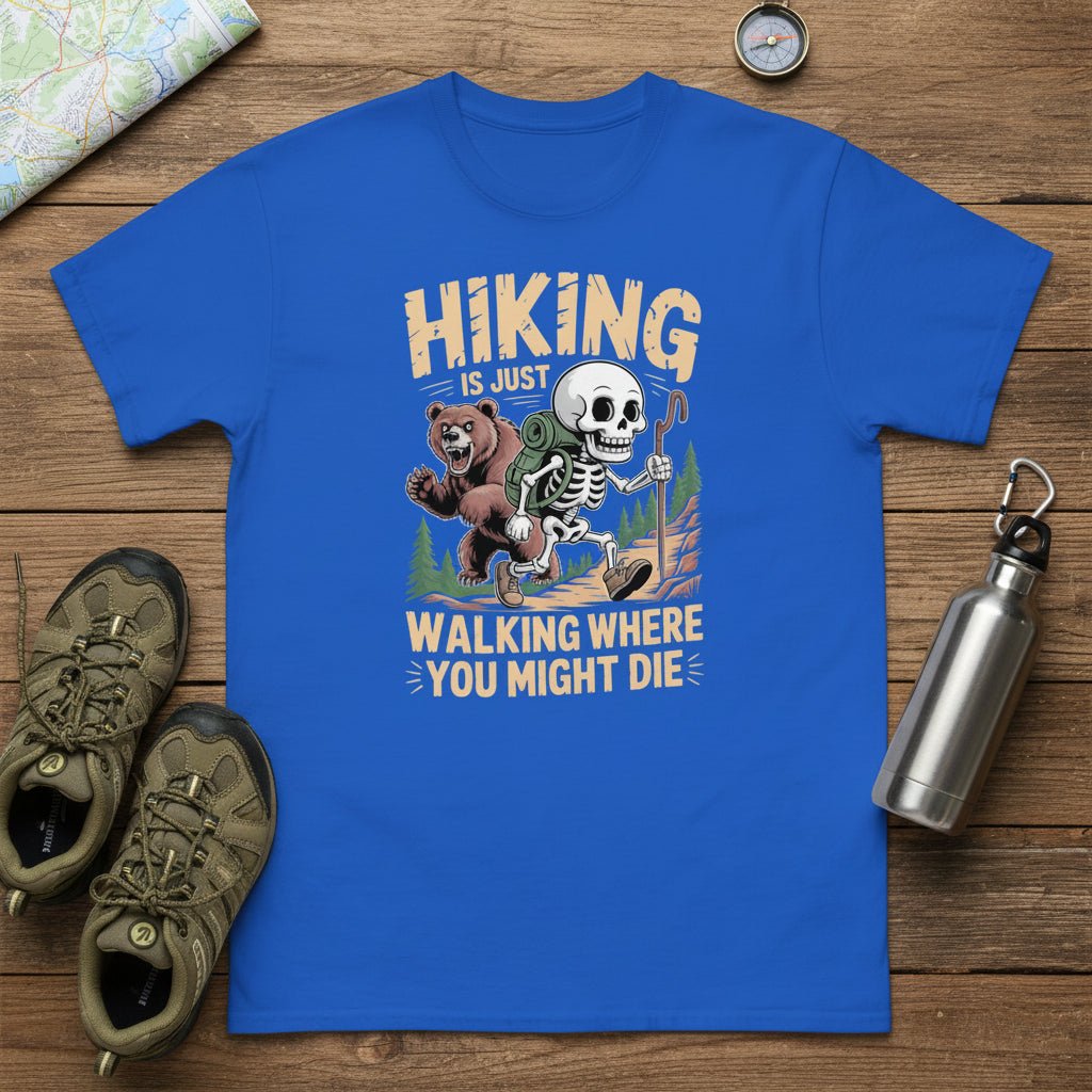 Royal blue graphic hiking T-shirt with skull-and-bear cartoon and slogan text.