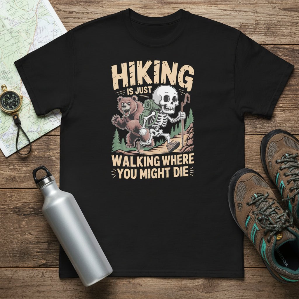 Black hiking T-shirt with skull-and-forest front graphic and text 'Walking where you might die'