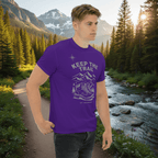Purple hiking T-shirt with mountain and boot graphic and 'KEEP THE TRAIL' print on model