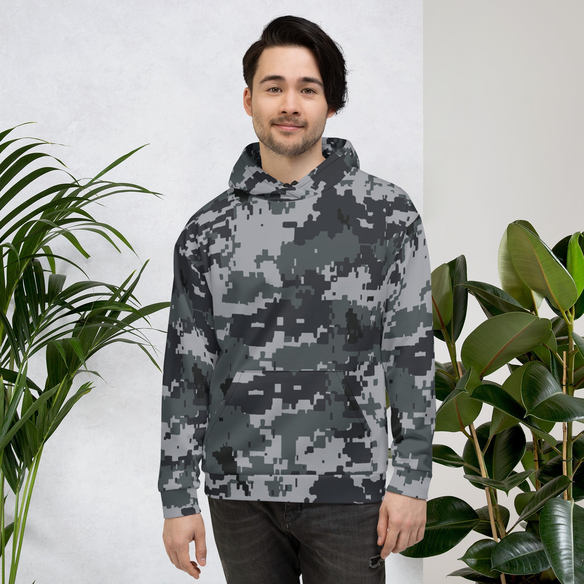 Camo pullover hoodie on model with hood and drawstrings; gray-and-dark camouflage pattern