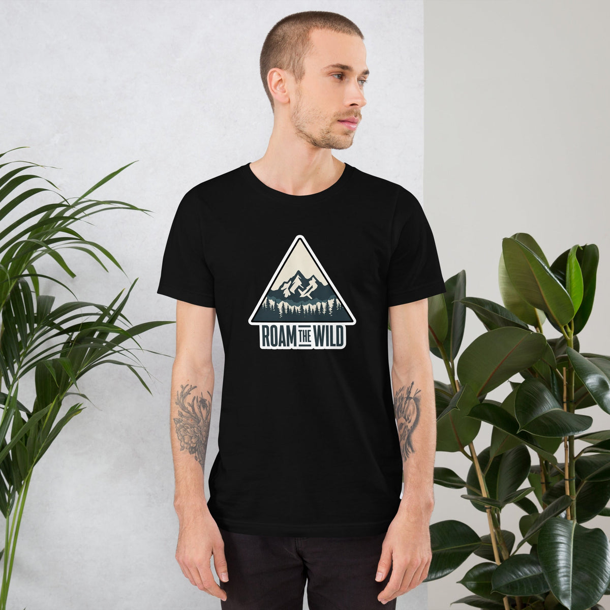 Black unisex hiking T-shirt with Roam the Wild mountain logo graphic on chest