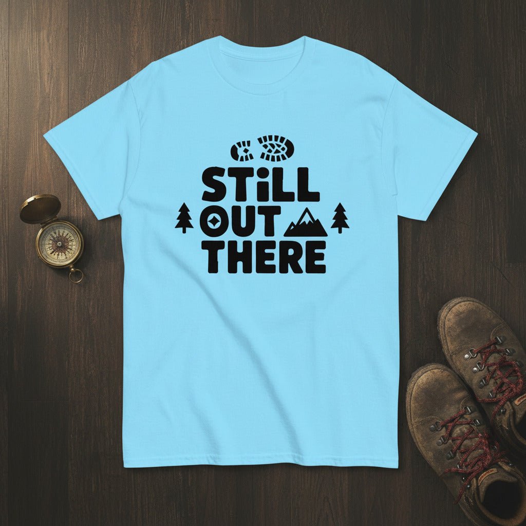 Sky blue hiking T-shirt with black 'Still Out There' logo and tree graphic