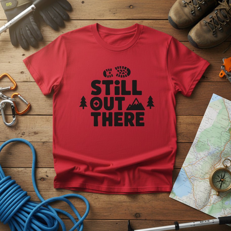Red hiking T-shirt with black 'Still Out There' logo and tree graphic