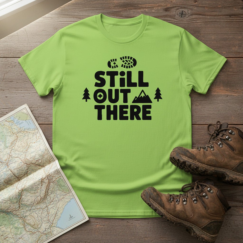 Lime green hiking T-shirt with black 'Still Out There' logo and tree graphic