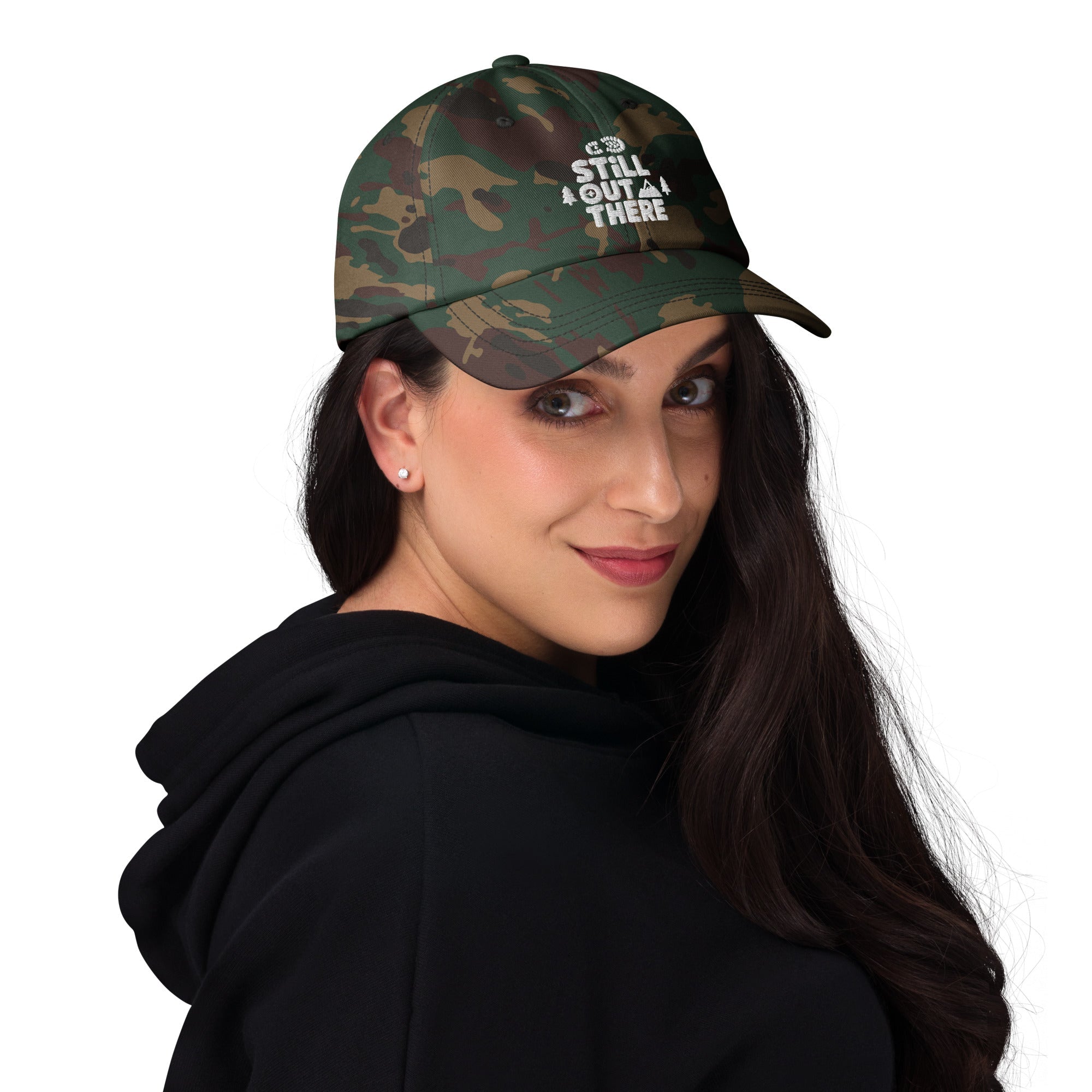 Dark camo embroidered dad hat worn by person, curved brim and adjustable fit
