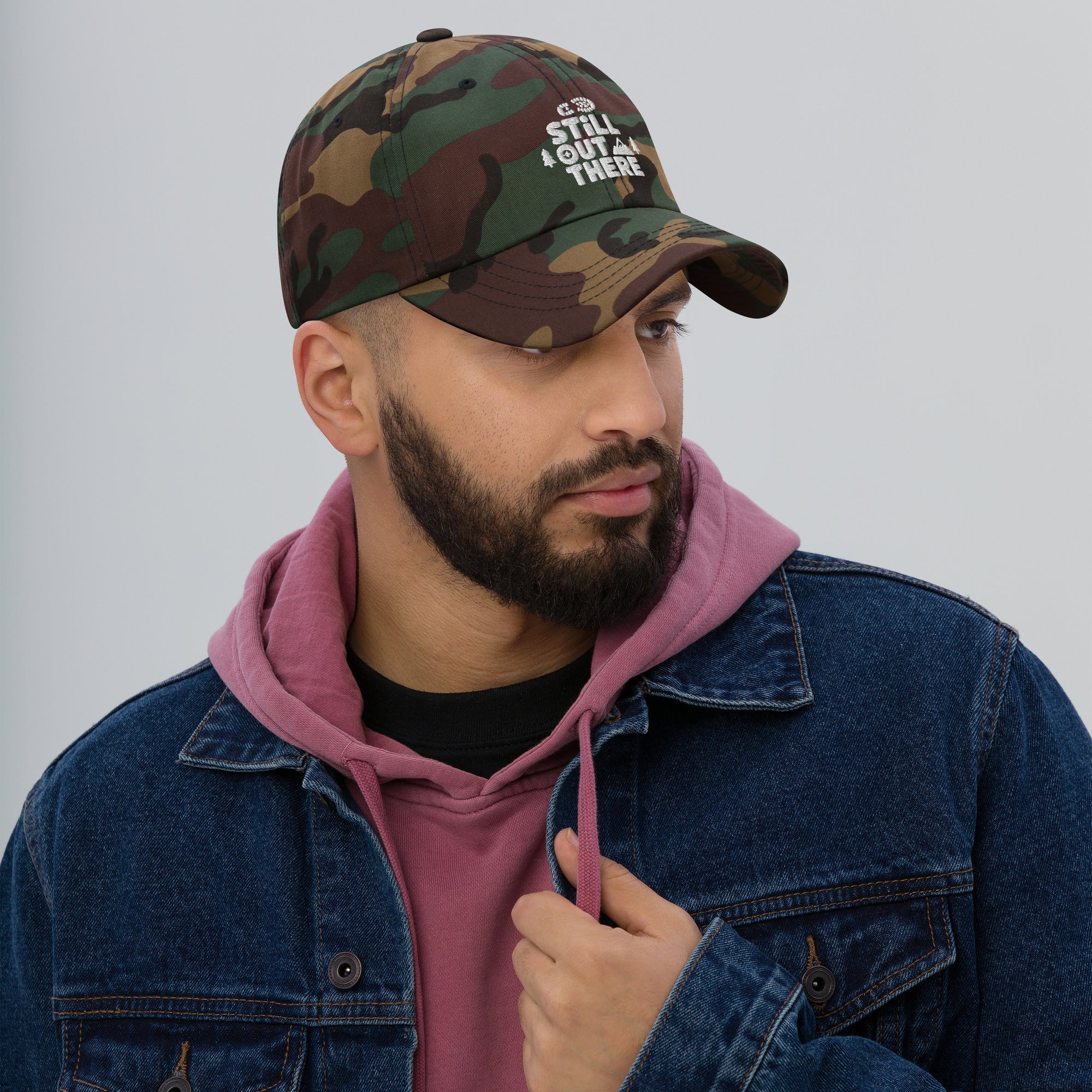 Camo embroidered dad hat with curved brim and adjustable strap, dark green and brown.