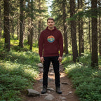 Maroon vintage-style mountain hoodie with front pocket and hood, colorful chest logo