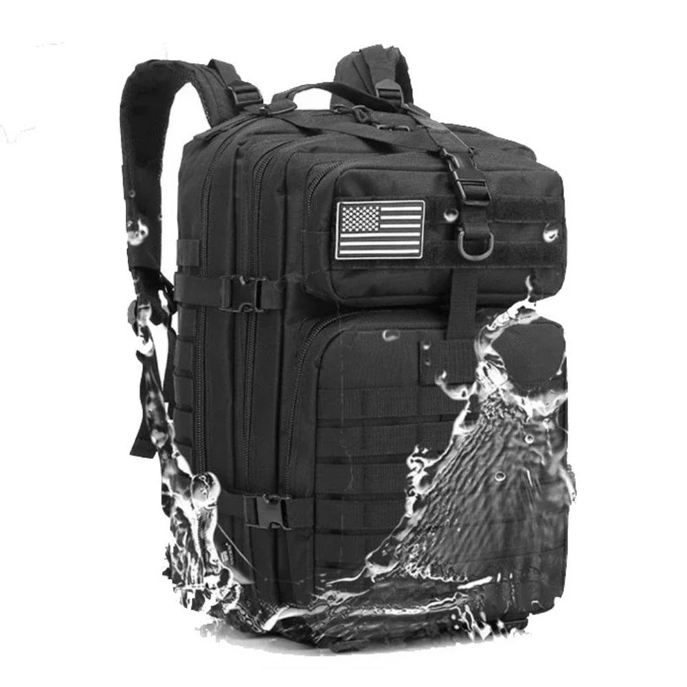 Black tactical MOLLE backpack with front panel straps and U.S. flag patch