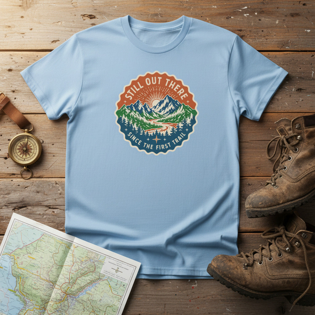 Light blue hiking t-shirt with circular trail badge graphic at center chest.