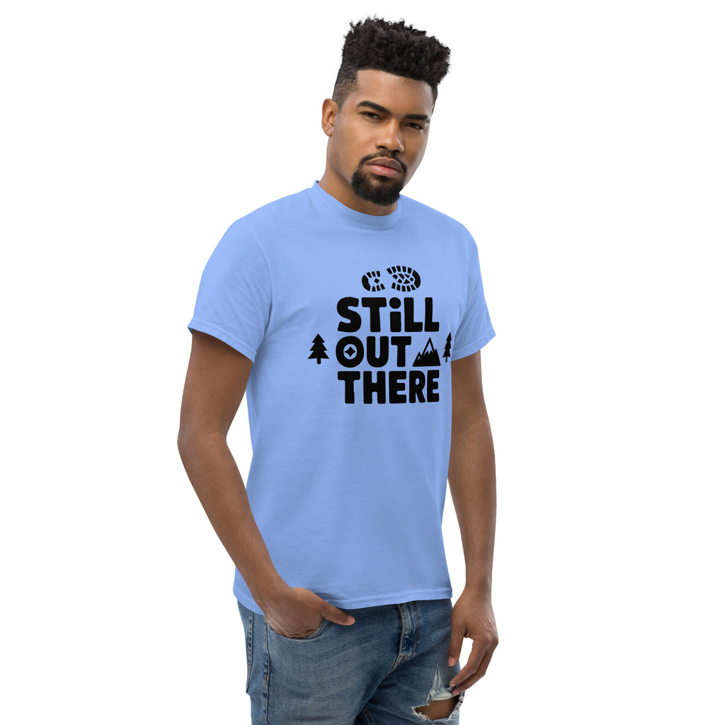Light blue hiking T-shirt with black "Still Out There" logo graphic on the chest