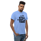 Light blue hiking T-shirt with black "Still Out There" logo graphic on the chest