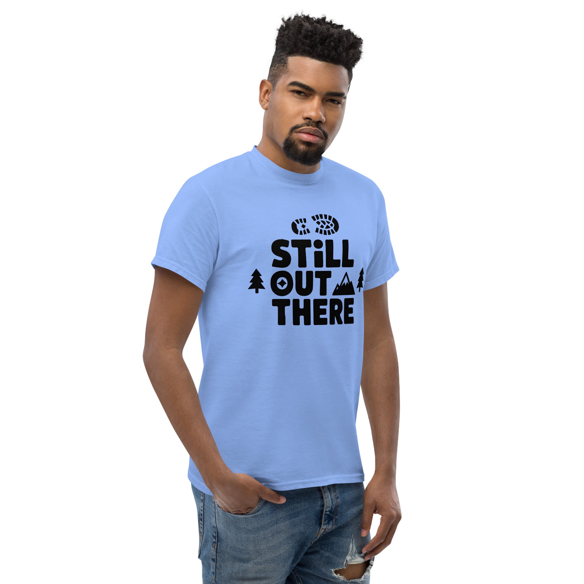 Light blue hiking T-shirt with black "Still Out There" logo graphic on the chest