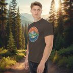 Dark brown T-shirt with a circular trail badge graphic printed on the chest.