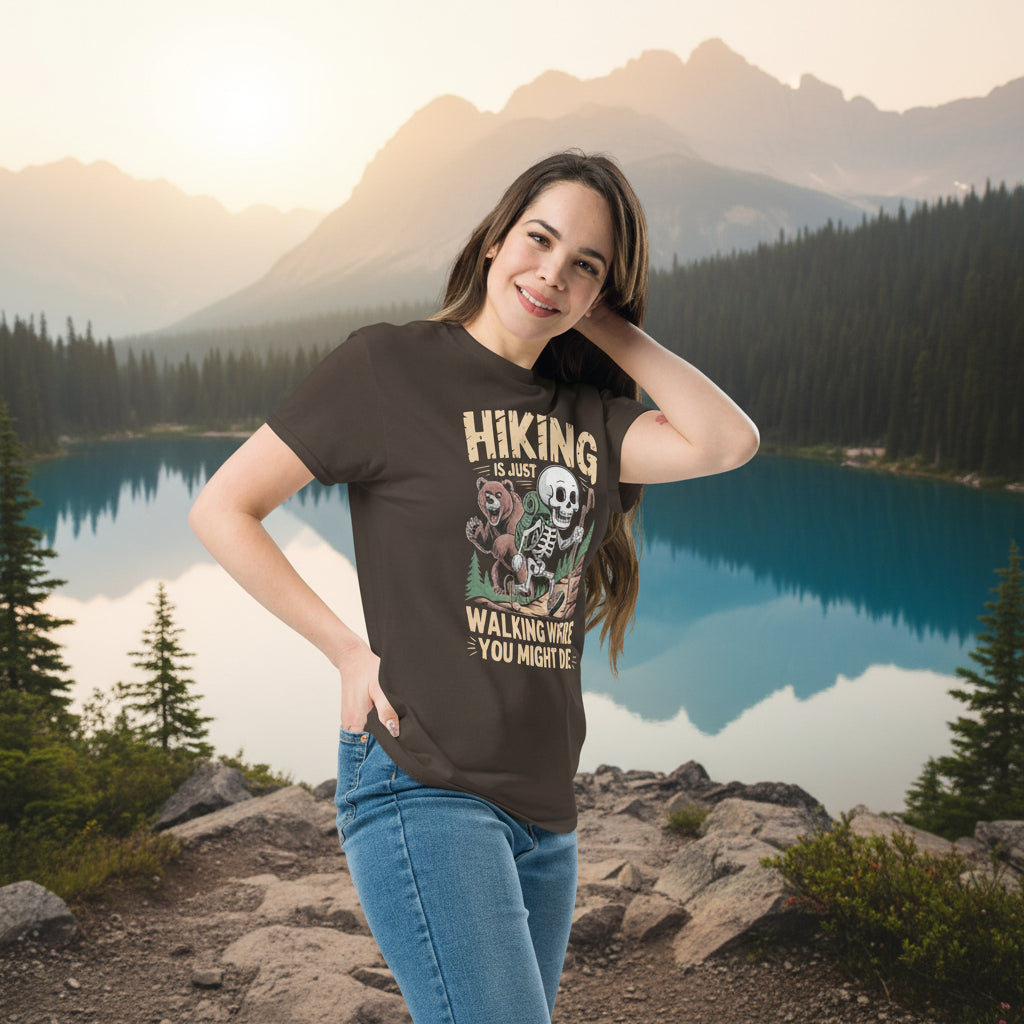 Dark brown hiking T-shirt on model with skull-and-forest front graphic and text