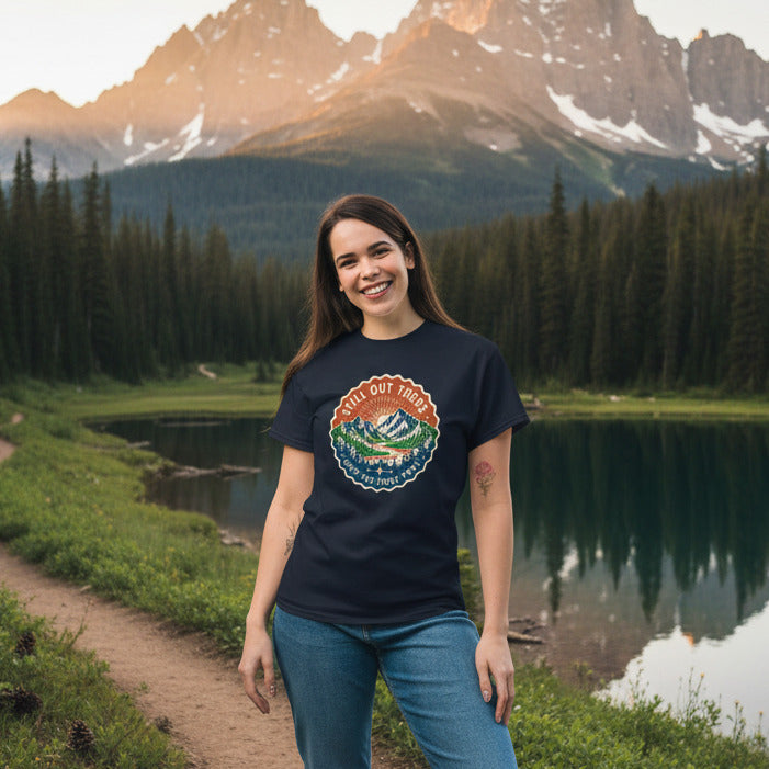Black T-shirt with circular multicolor trail badge logo centered on the chest.