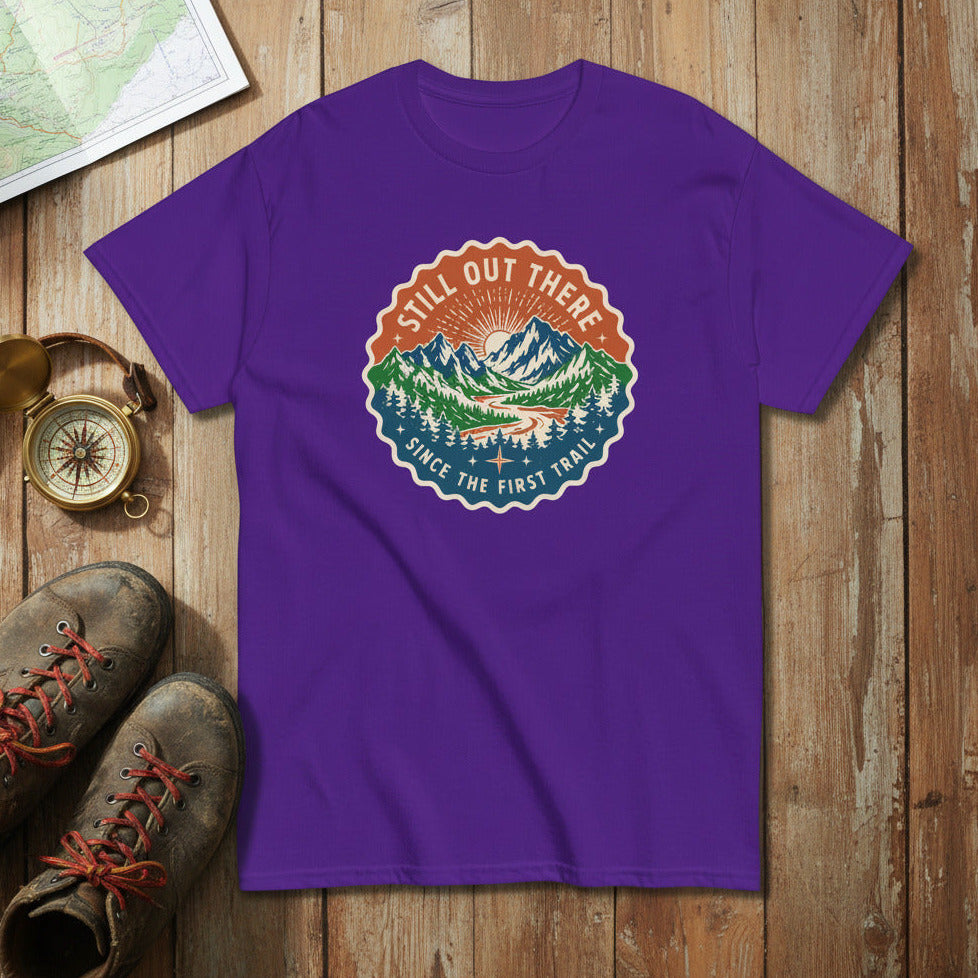 Purple hiking t-shirt with circular trail badge graphic at center chest.