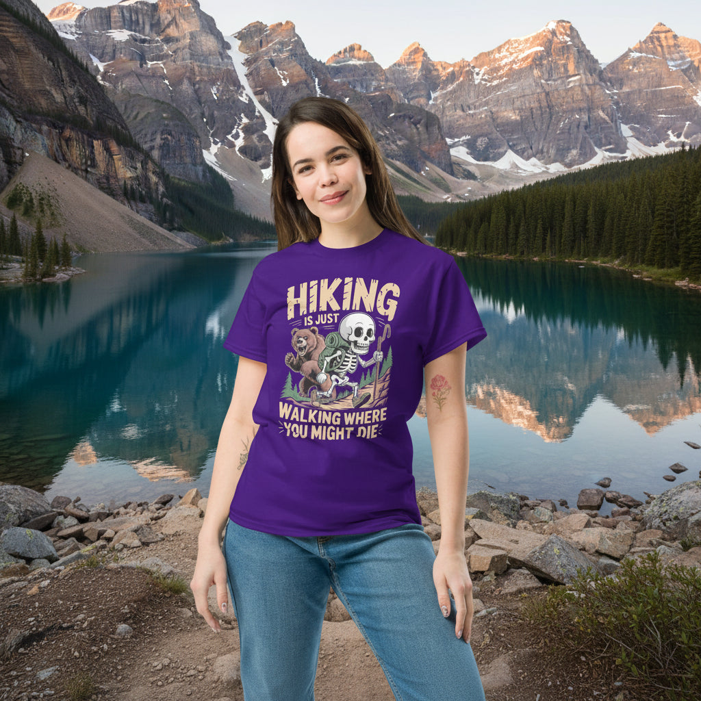 Purple hiking T-shirt on model with skull-and-forest front graphic and 'Walking where you might die'